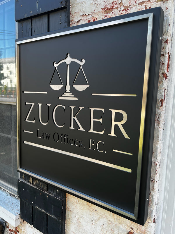 Zucker Law Offices, P.C. sign on a building exterior fabricated by HM Metalworks