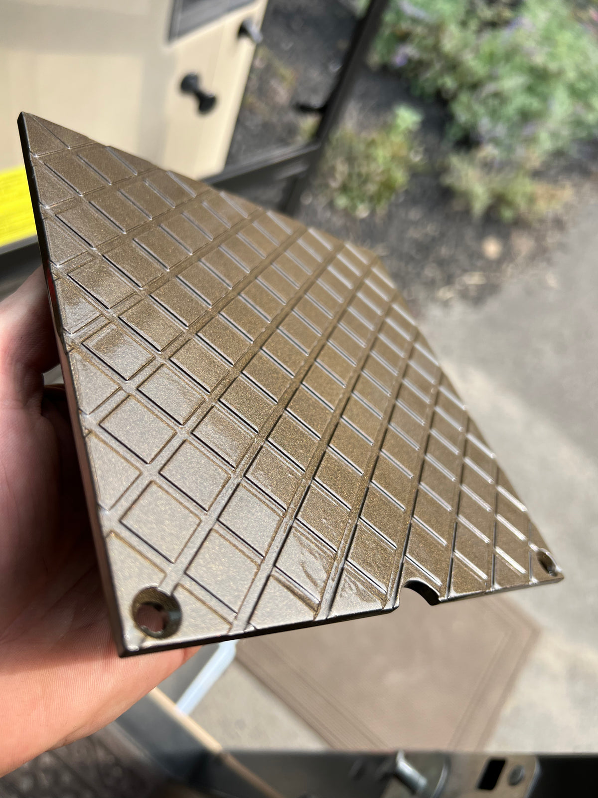 Close-up of powder coated metal finish for custom fabrication projects at HM Metalworks