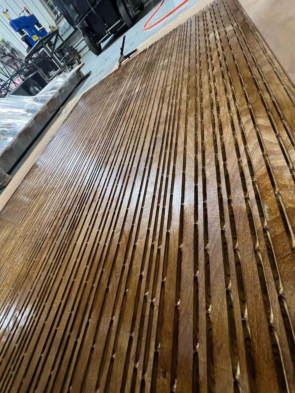 CNC router cutting custom decorative wood board for precision fabrication at HM Metalworks