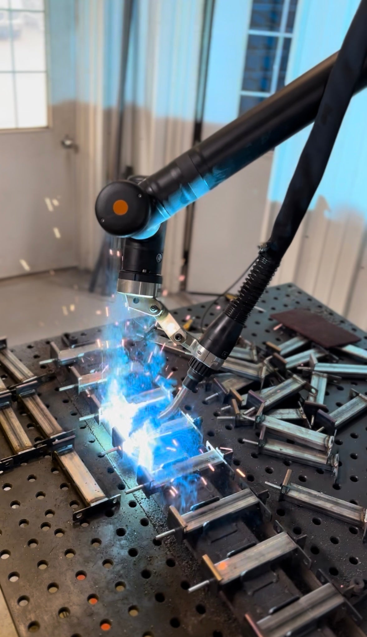 Robotic laser welding steel components for precision metal fabrication at HM Metalworks