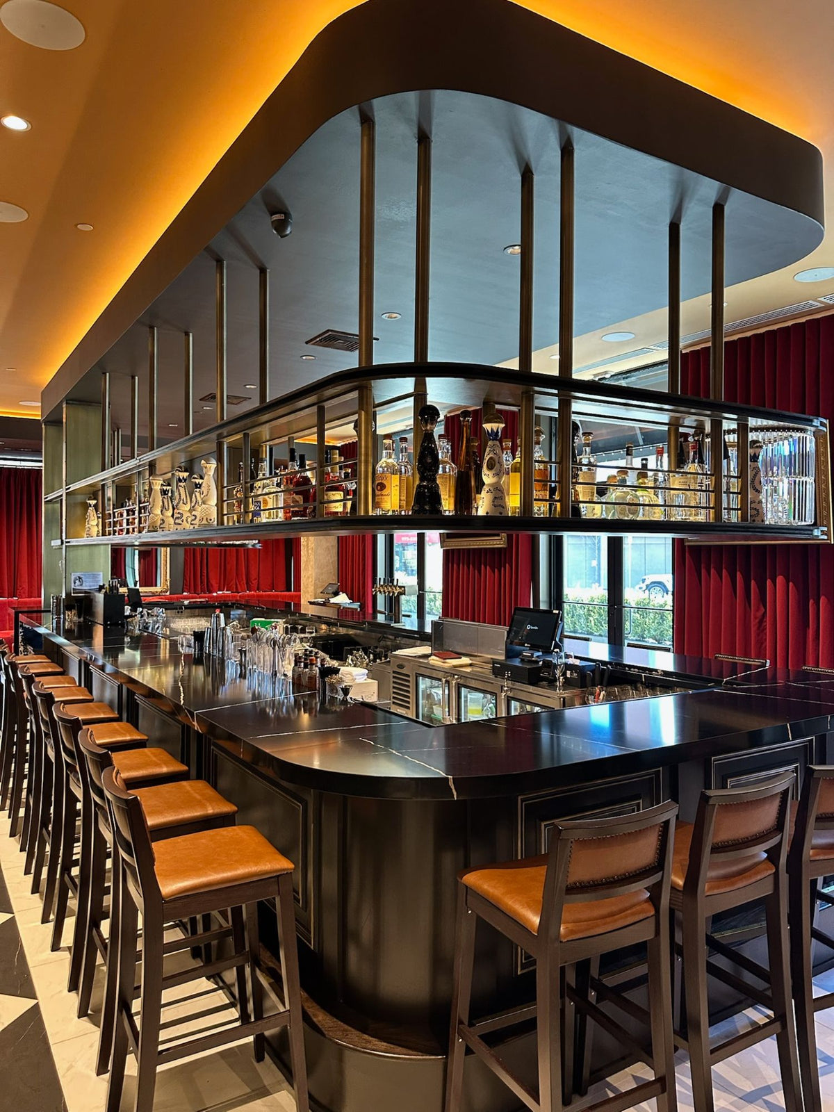 Overhead bar rack hung above the bar at Masseria Italian Steakhouse in Morristown, NJ, built by HM Metalworks